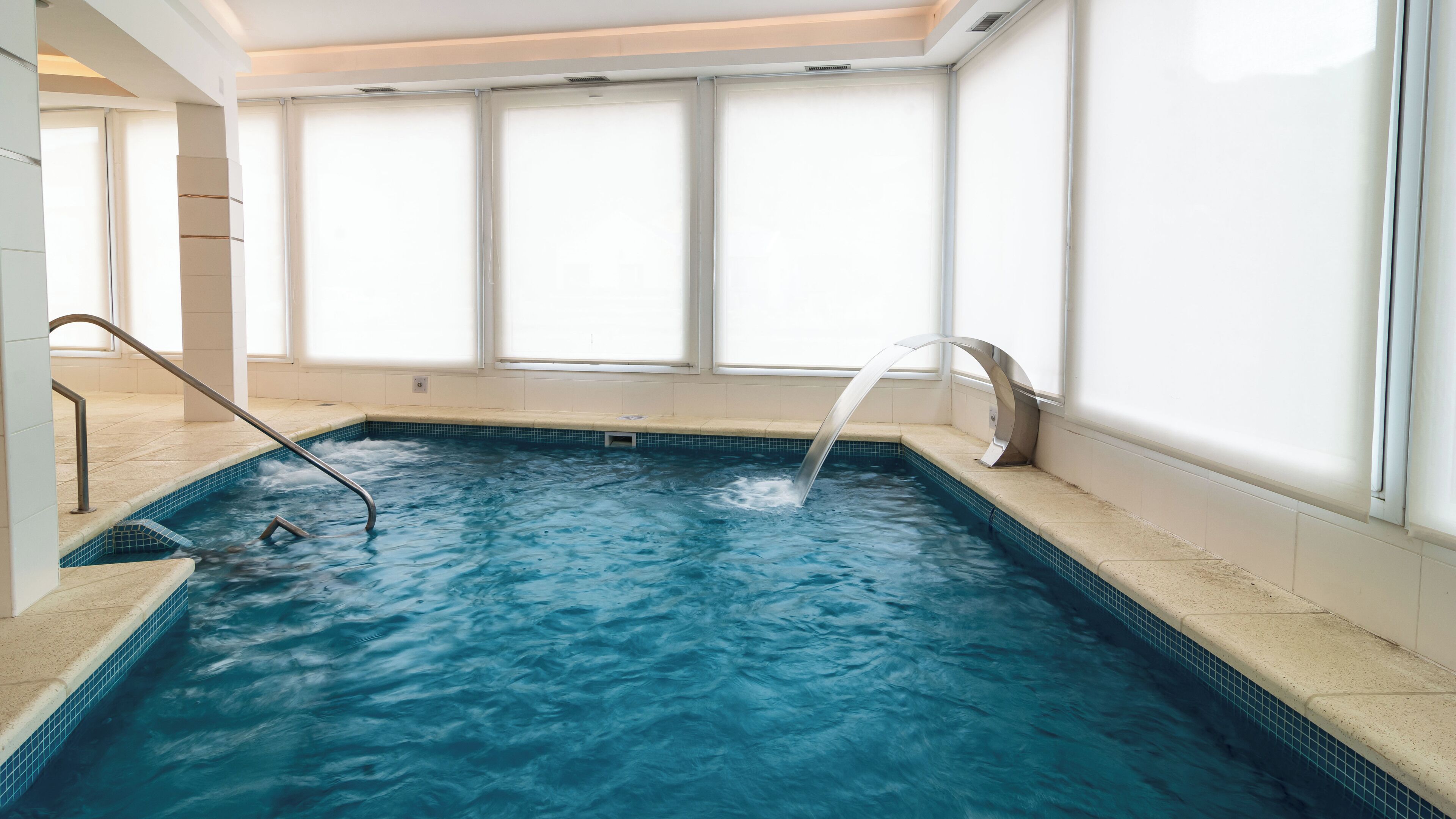 indoor pool, pool umbrellas, lifeguards on site