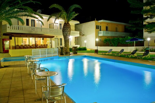 Seasonal outdoor pool, pool umbrellas, pool loungers