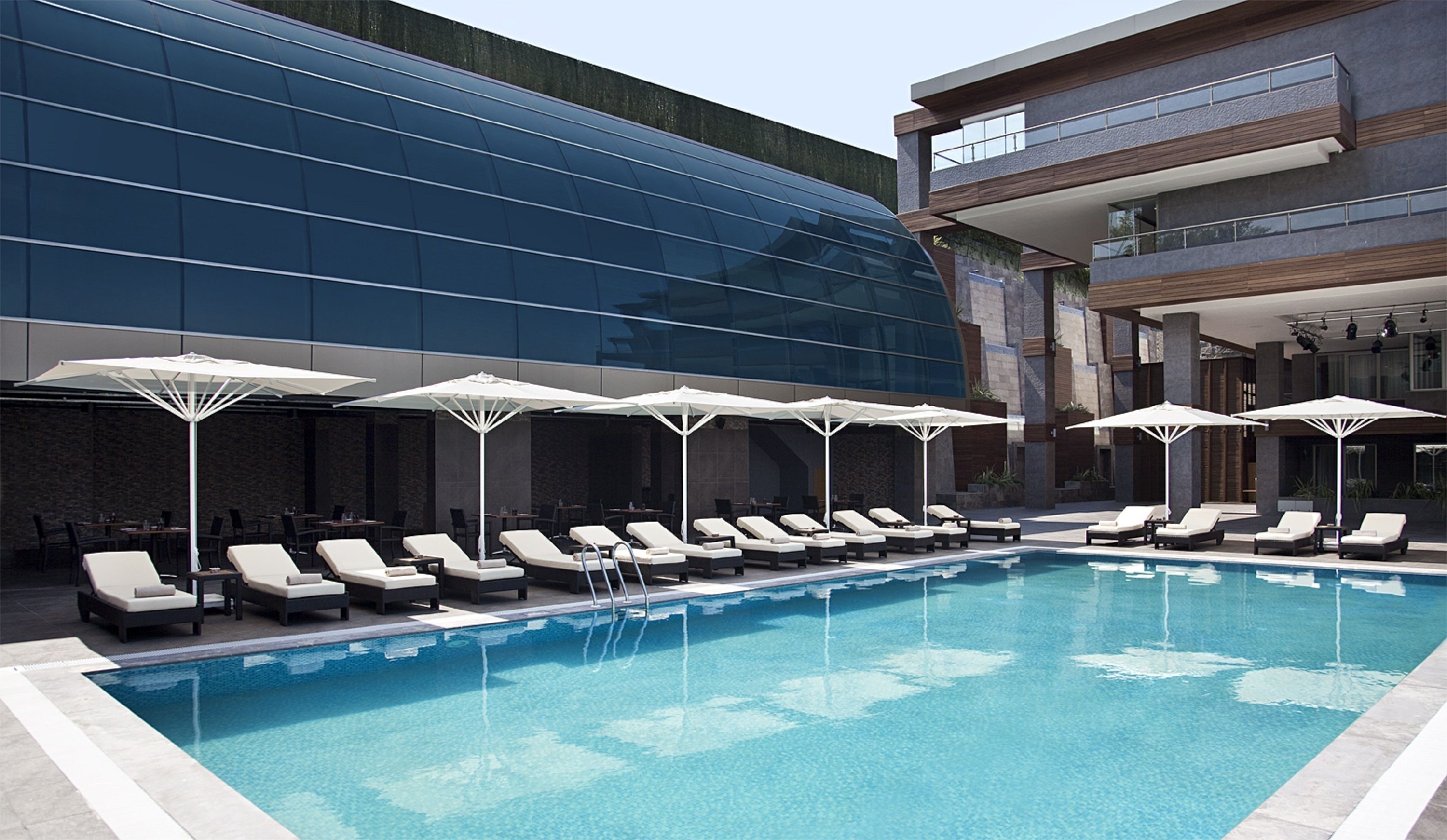 seasonal outdoor pool, open 11:00 am to 6:30 pm, pool umbrellas