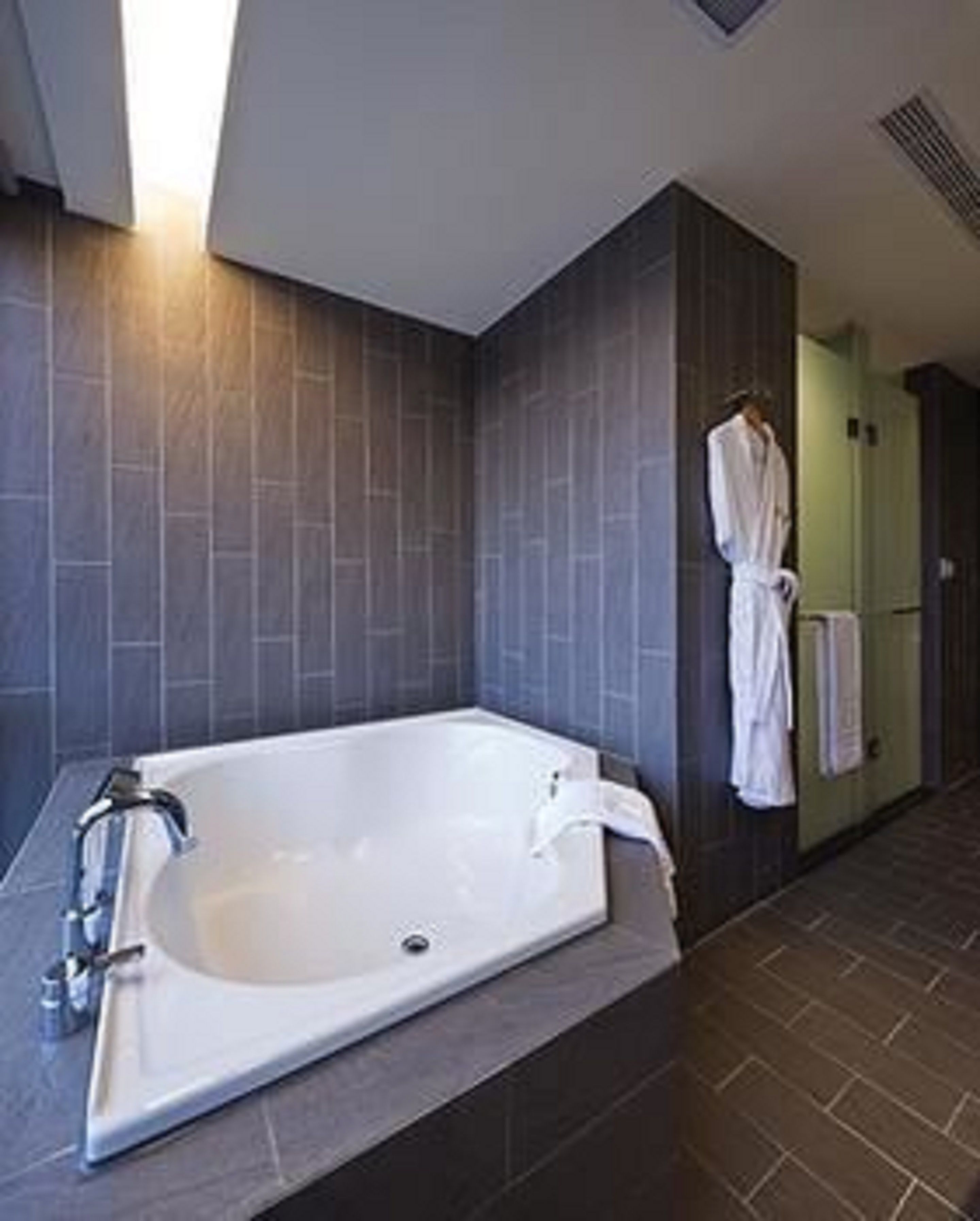 deluxe suite, 1 king bed | bathroom | hair dryer
