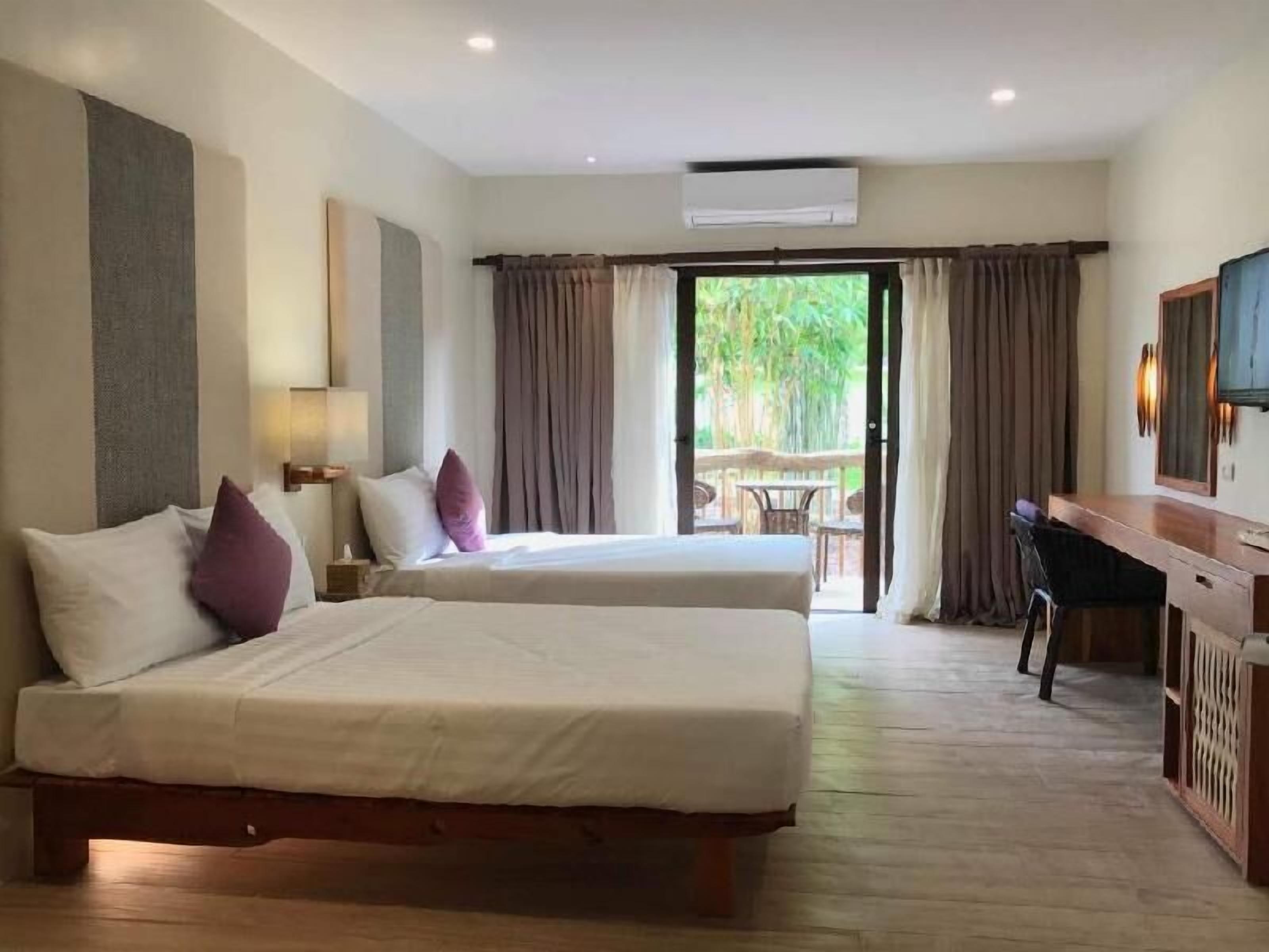 Luxe beddengoed, een minibar, een kluis op de kamer