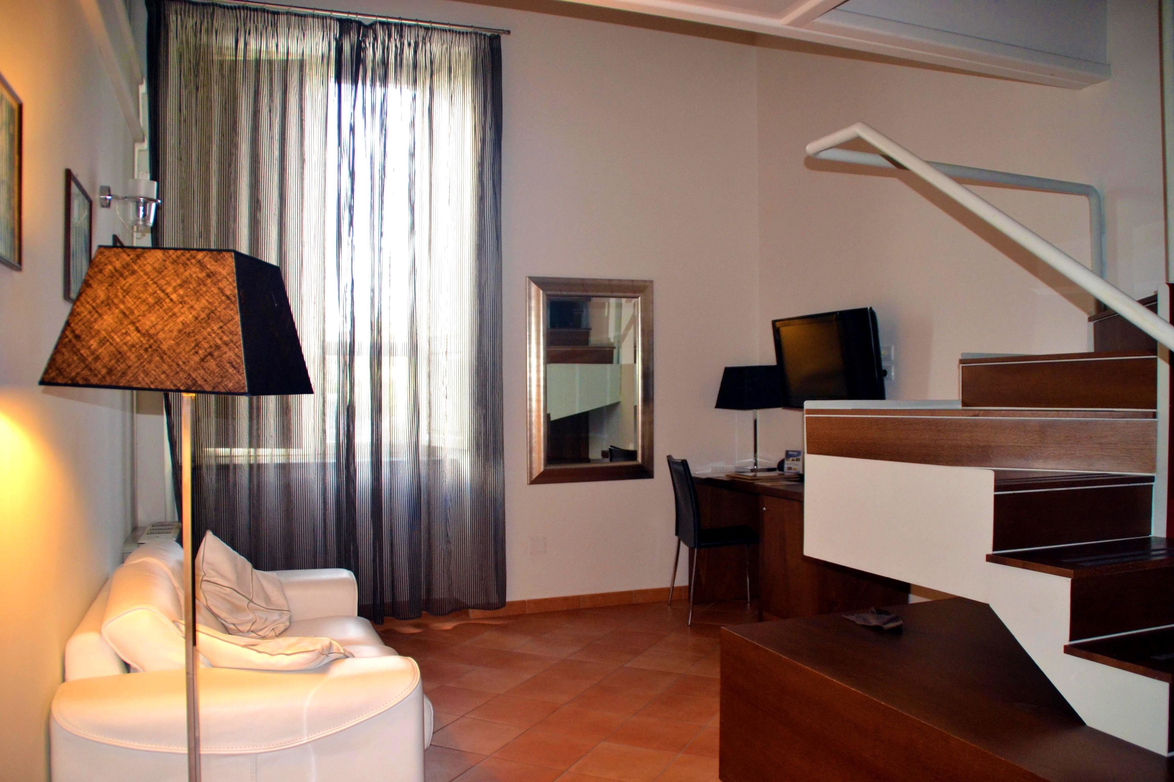 junior suite | 1 bedroom, minibar, in-room safe, desk