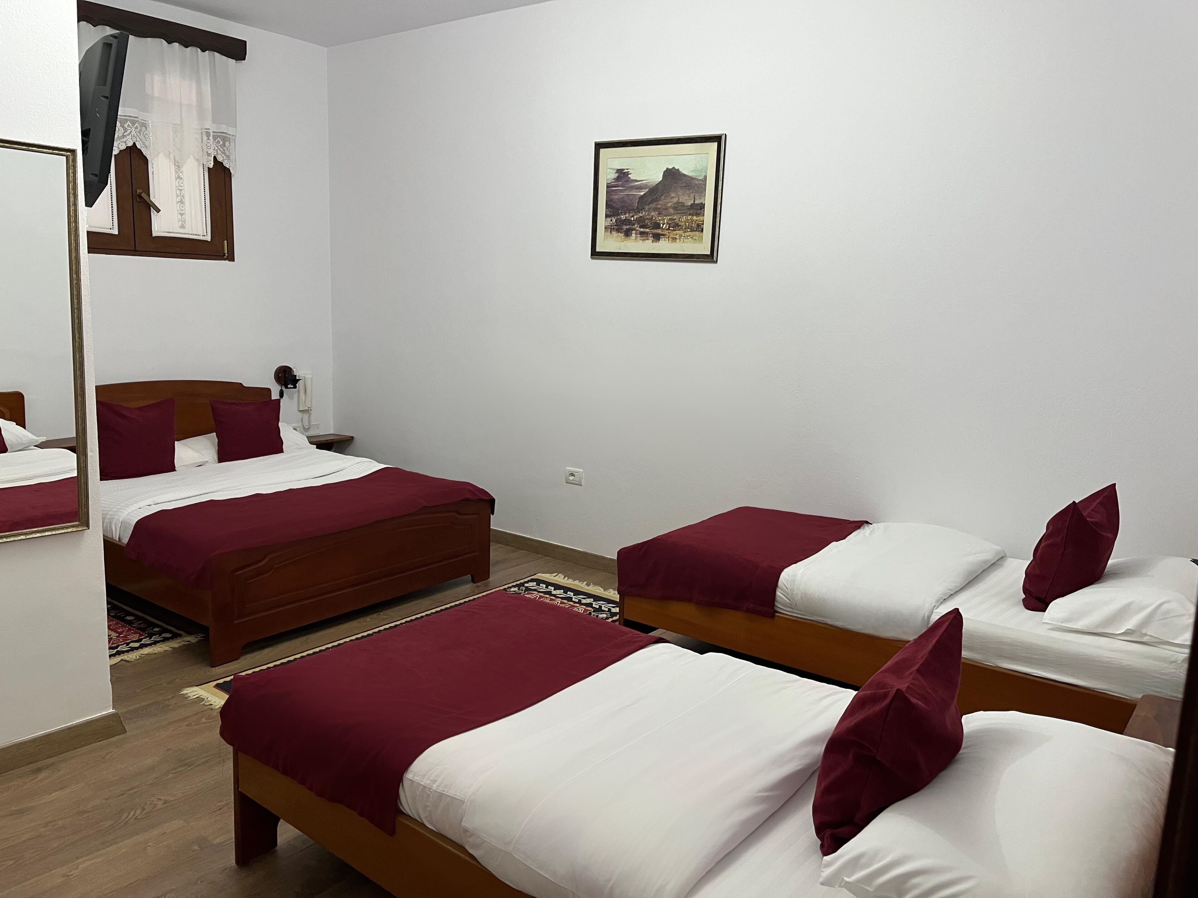 Standard Quadruple Room | Down comforters, minibar, individually decorated, desk