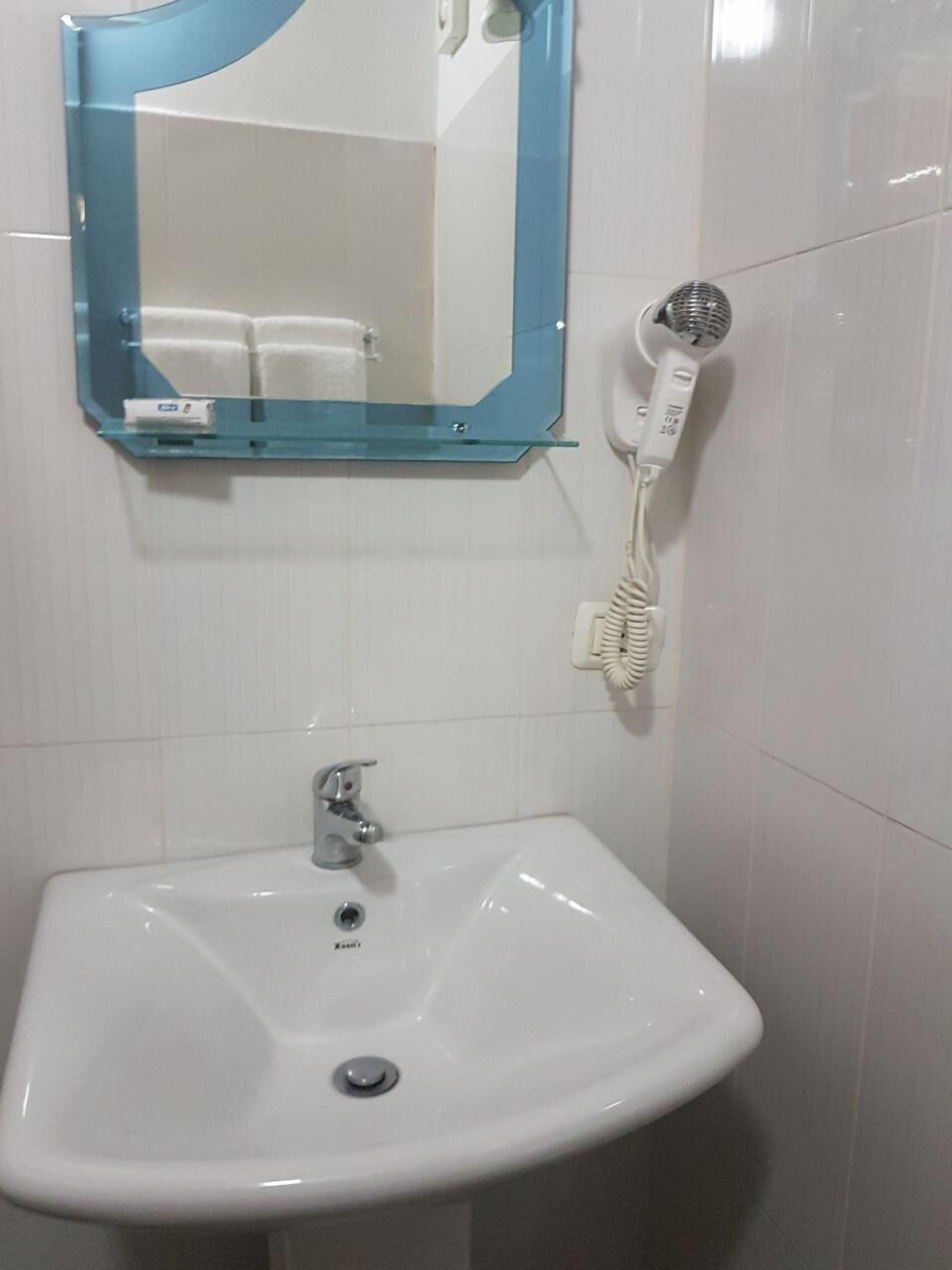 separate bathtub and shower, free toiletries, hair dryer, slippers