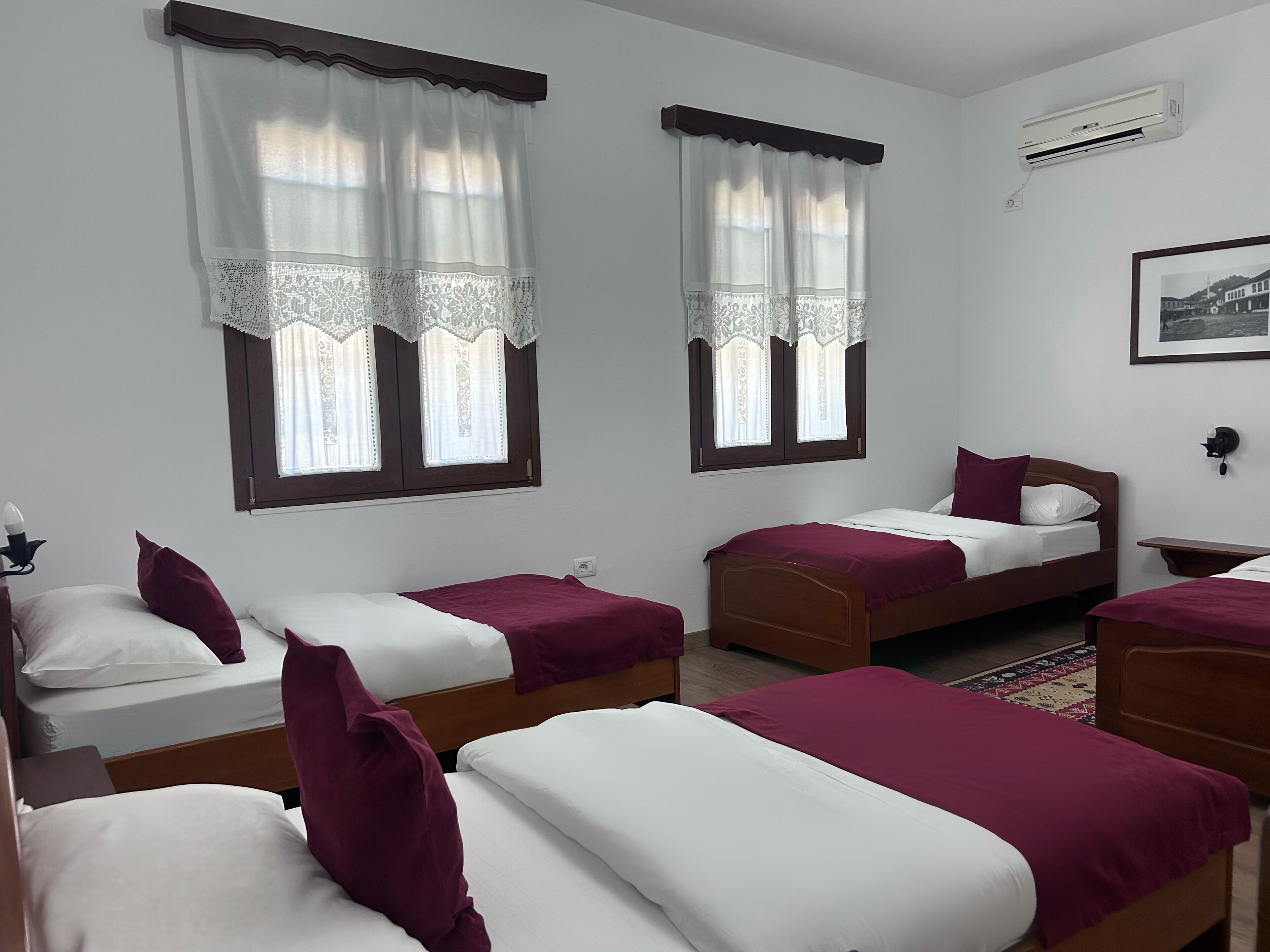 Deluxe Quadruple Room | Down comforters, minibar, individually decorated, desk