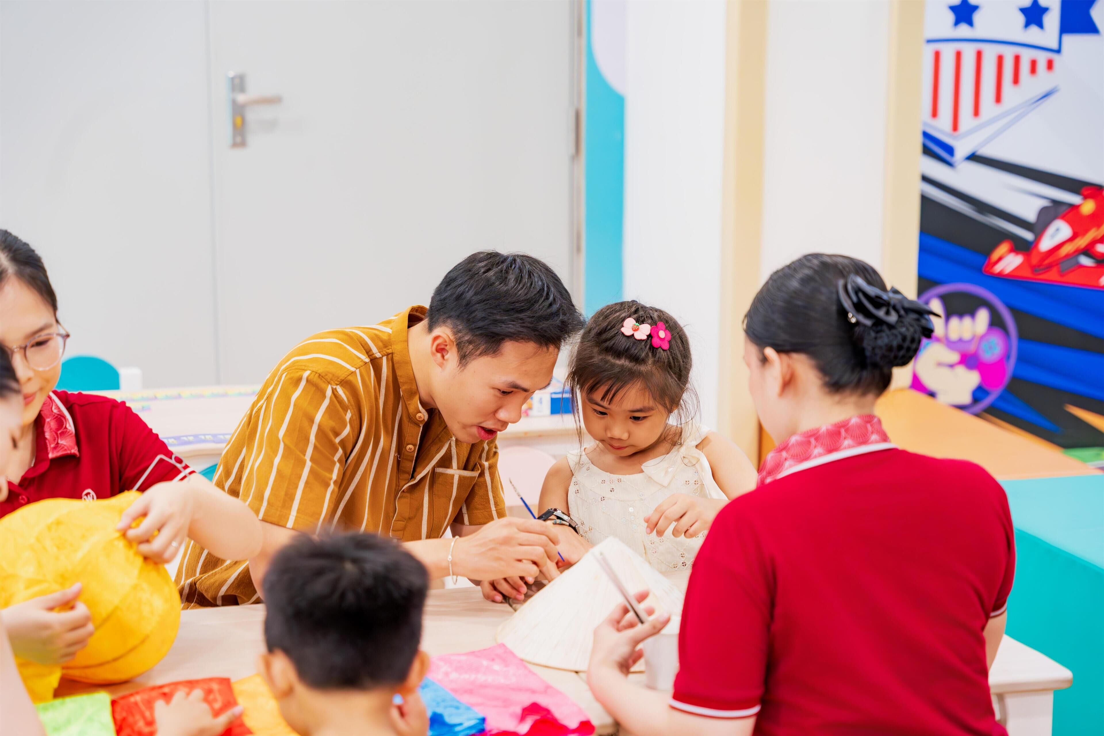 A group of people engaged in a craft activity at a table.