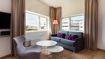 Desk, laptop workspace, iron/ironing board, bed sheets