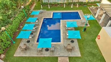 Outdoor pool, open 10:00 AM to 10:00 PM, pool umbrellas, pool loungers