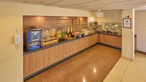 A buffet area with a self-service beverage station, various food options, and a certificate of achievement on the wall. - City Express by Marriott Puebla Finsa (Cuautlancingo)