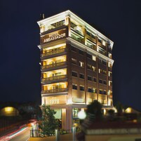 A multi-story hotel with balconies and a sign indicating it has been established since 1978.