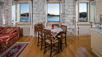 Apartment, 1 Bedroom, Sea View | Living area | 60-cm TV with satellite channels