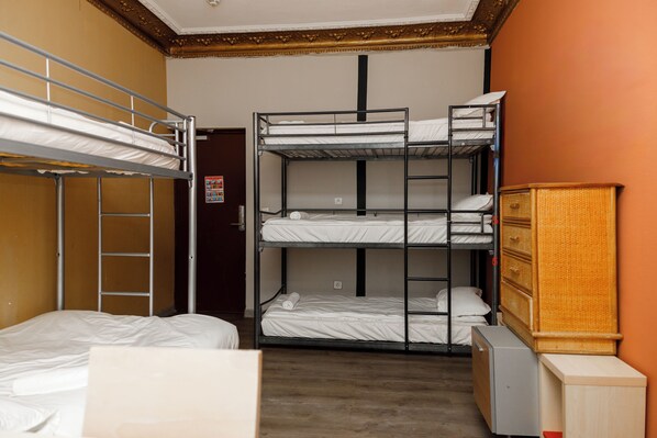 A bunk bed room with a wooden cabinet and a small desk. - Simple Stay - Fresh Start May 2026 (Nice)