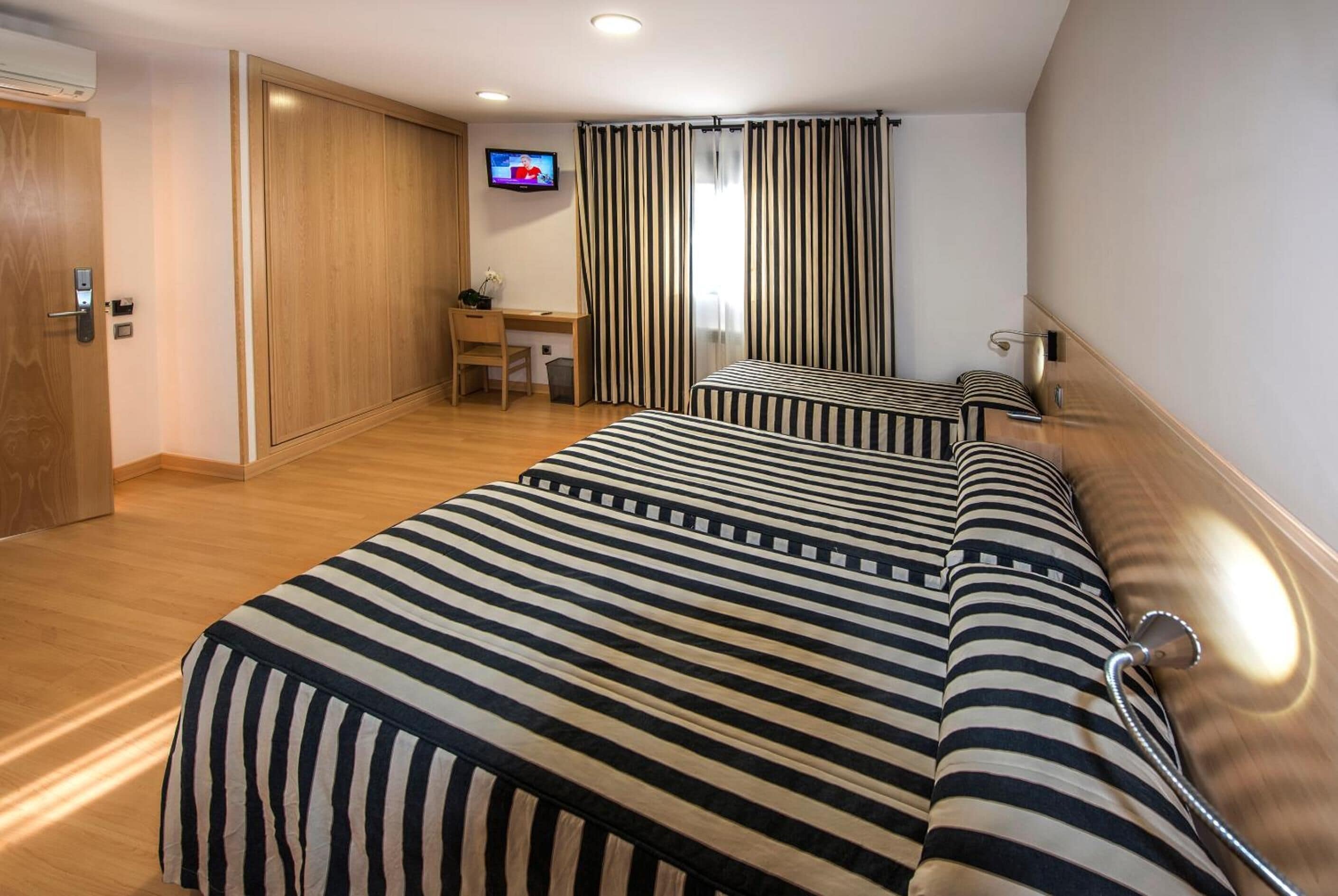 standard triple room | in-room safe, desk, soundproofing, free wifi
