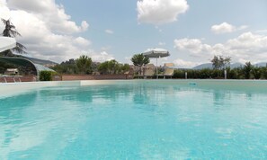 Seasonal outdoor pool, open 9:30 AM to 7:30 PM, pool umbrellas