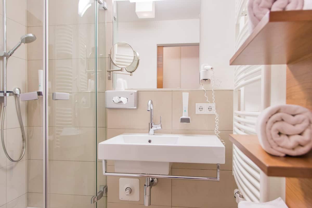 Separate bathtub and shower, free toiletries, hair dryer, slippers