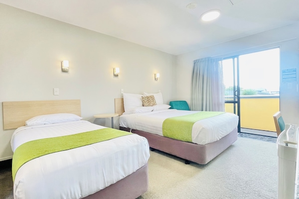 Executive Triple Room | Desk, laptop workspace, blackout curtains, iron/ironing board