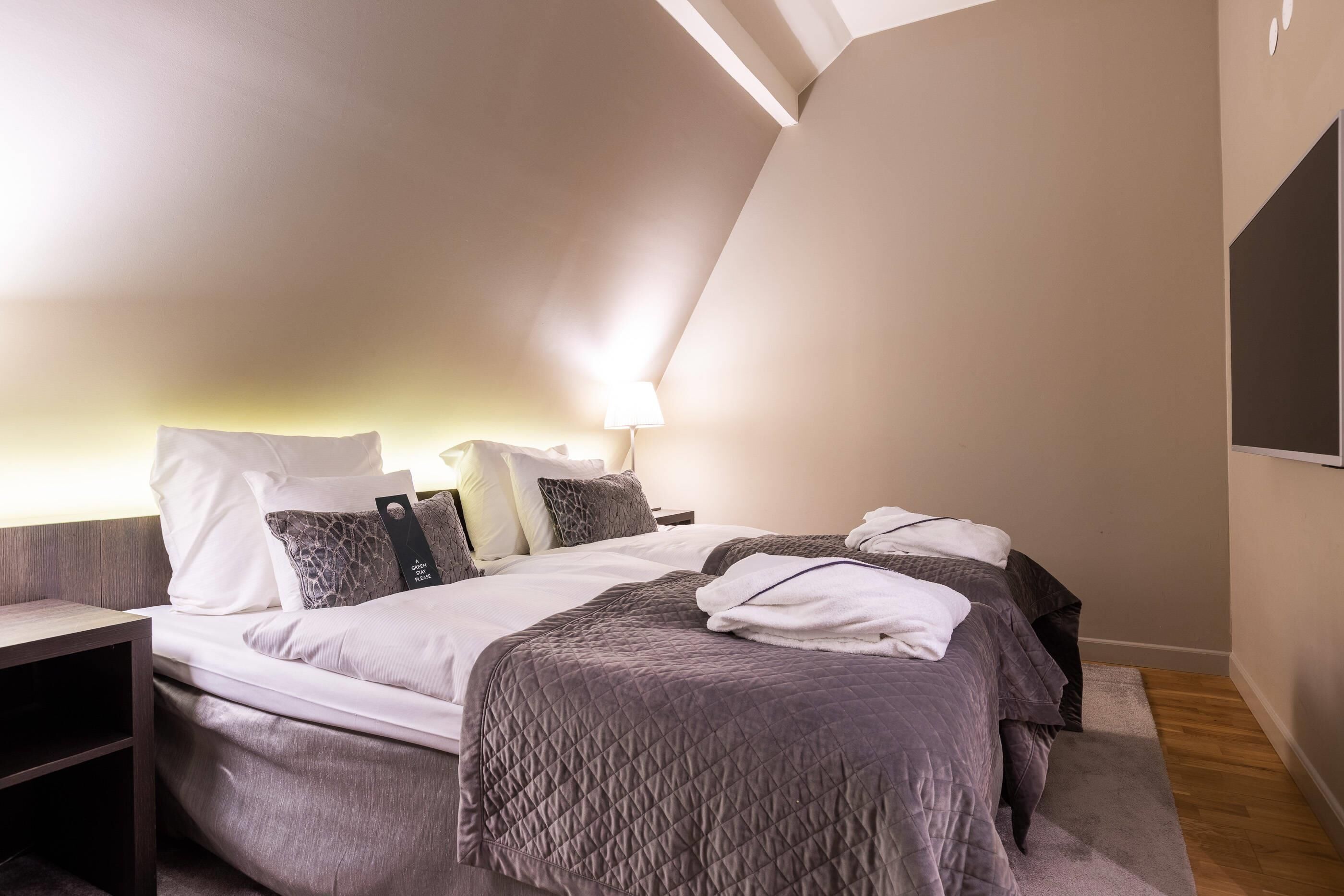 Deluxe Room, Multiple Beds, Non Smoking | Down duvets, minibar, desk, laptop workspace