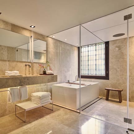 Deluxe Room | Bathroom | Designer toiletries, hair dryer, bathrobes, slippers