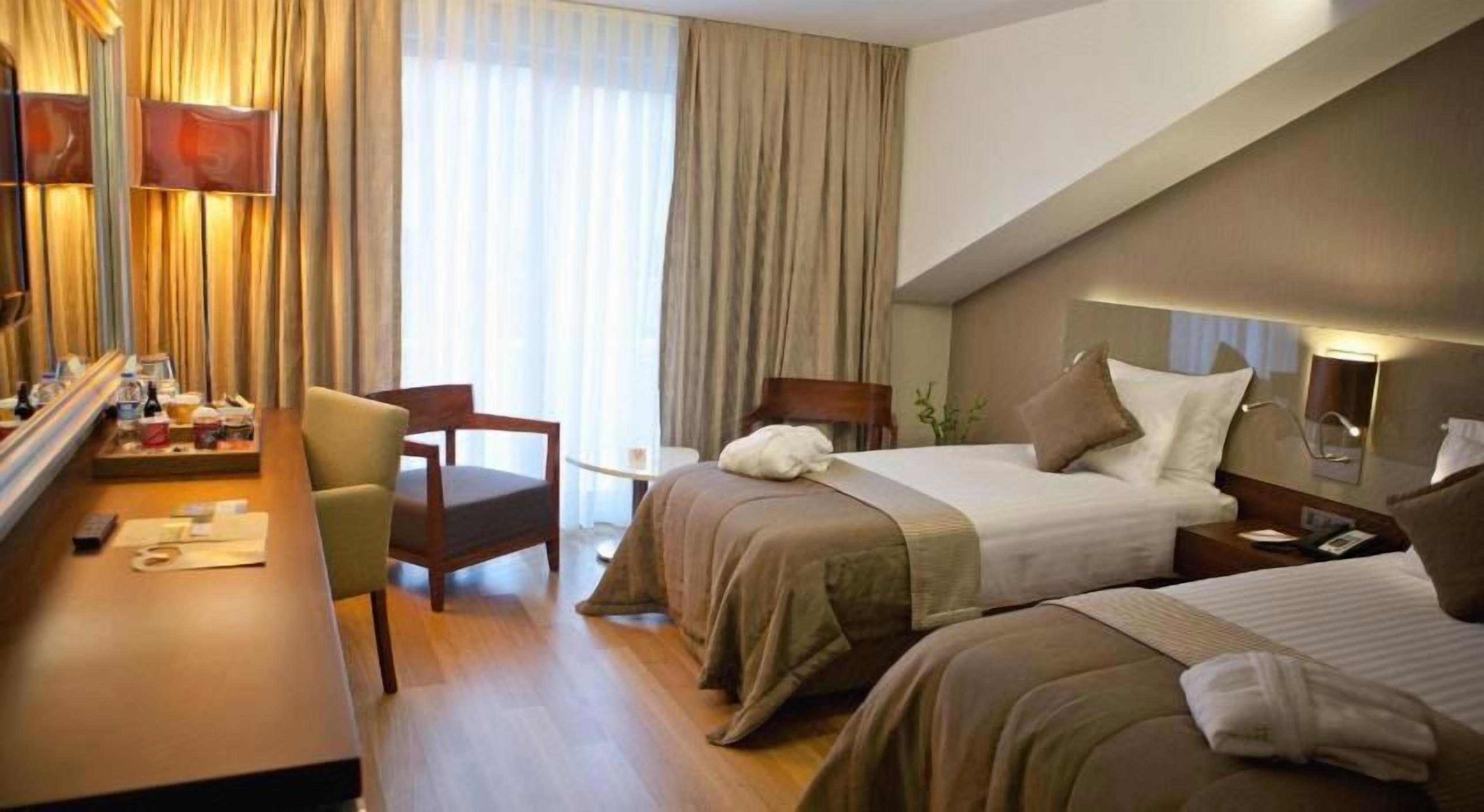 Premium bedding, memory foam beds, free minibar items, in-room safe