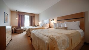 A hotel room with two beds, a desk, a chair, and a dresser. - Best Western Plus Chateau Inn Sylvan Lake (Sylvan Lake)