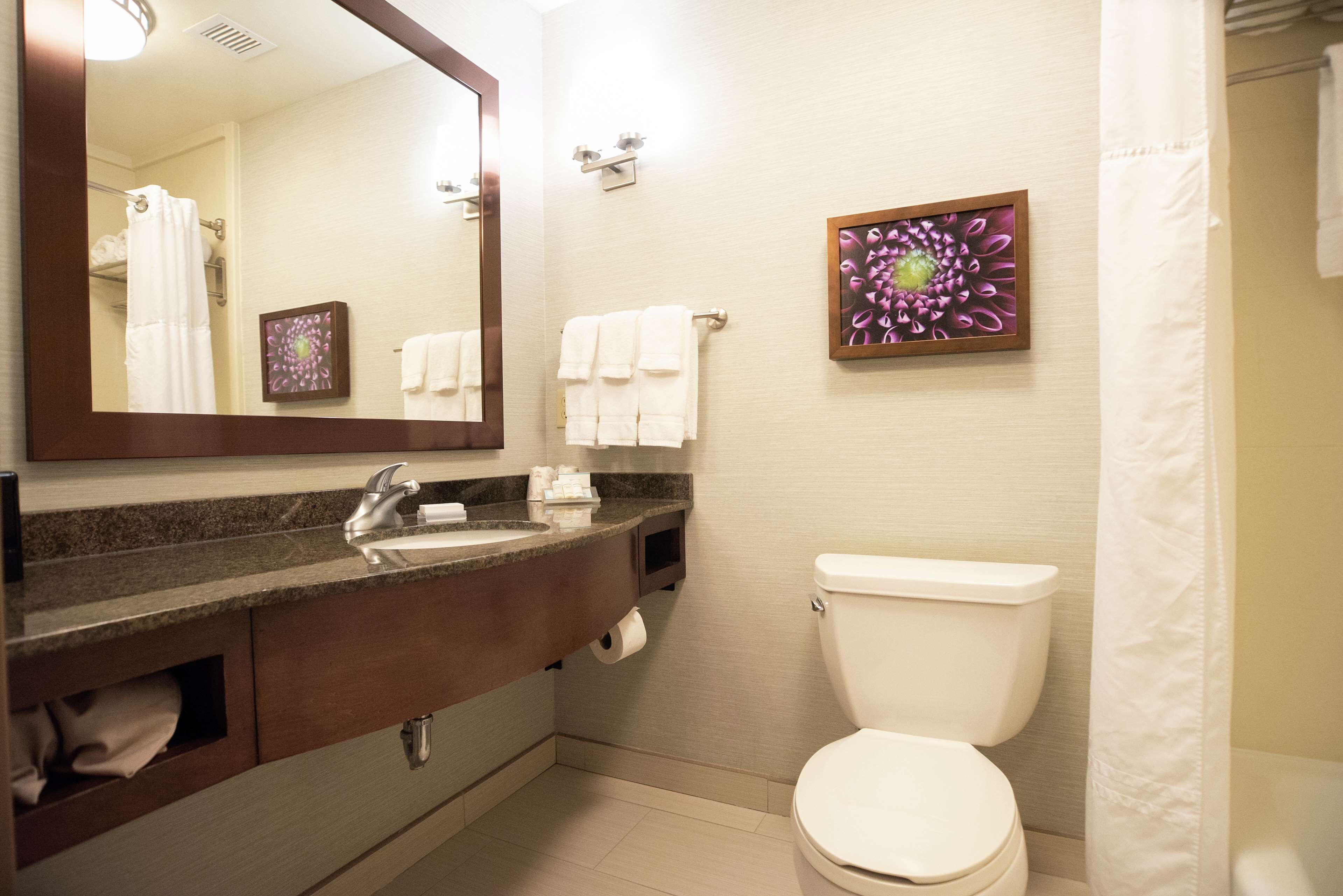 designer toiletries, hair dryer, towels, soap