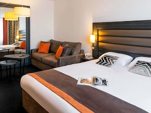 Family Room, 1 King Bed with Sofa bed | In-room safe, desk, soundproofing, iron/ironing board