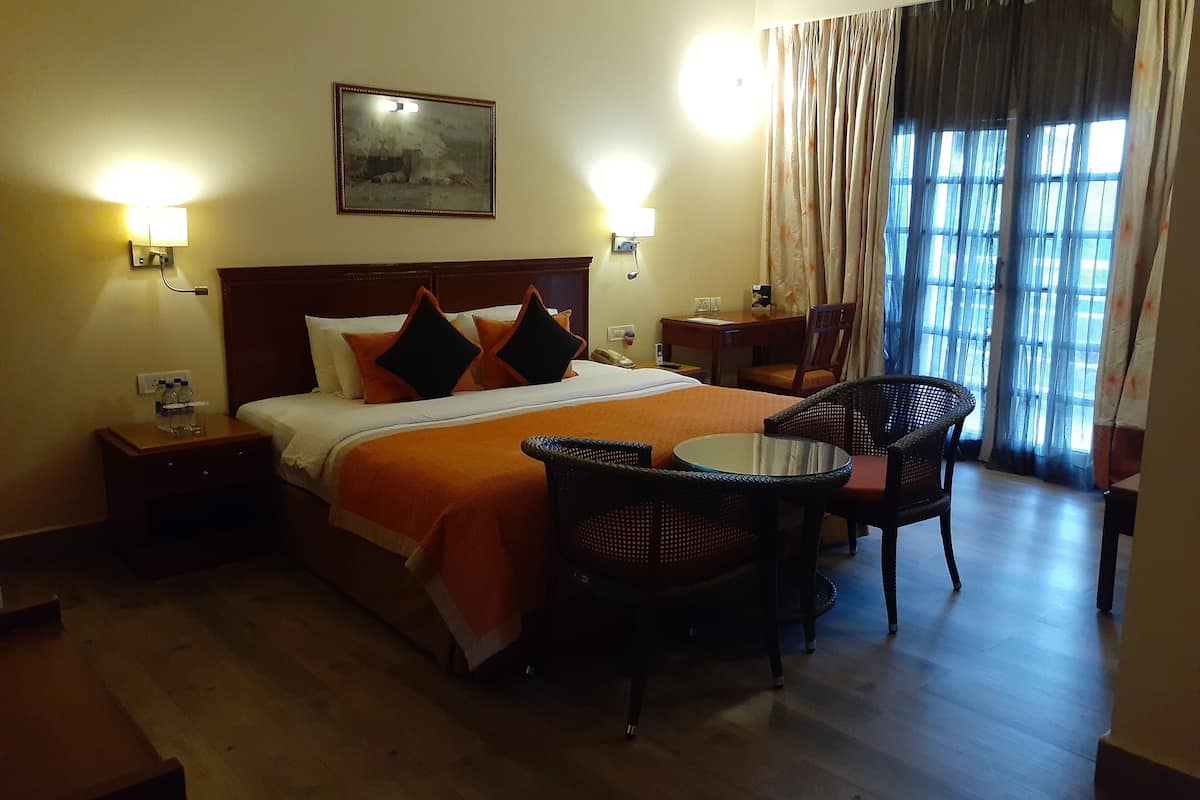 executive suite, garden view (with sit-out) | minibar, in-room safe, desk, blackout curtains