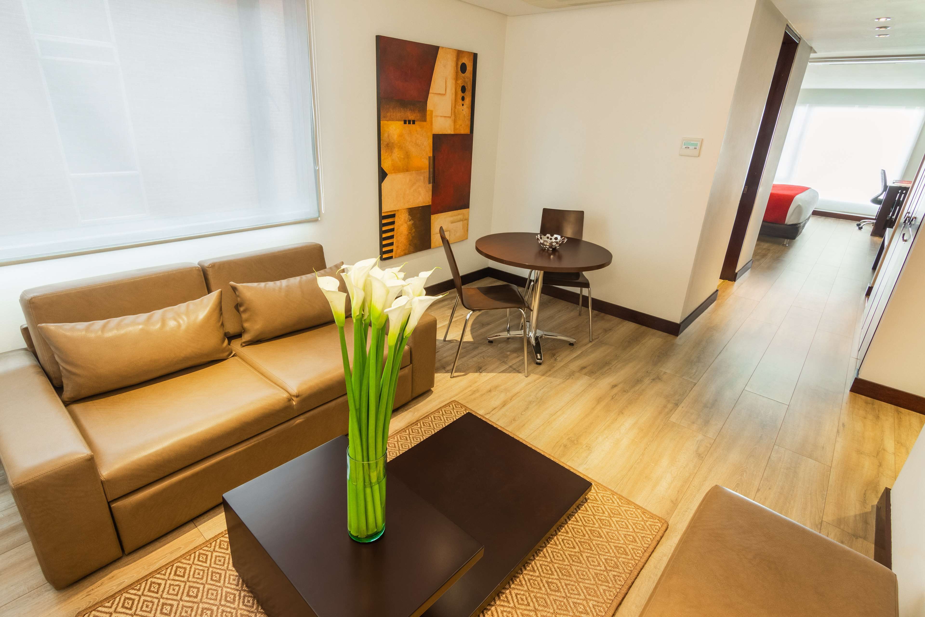 suite, 1 king bed, non smoking (living room) | down duvets, pillow-top beds, minibar, in-room safe