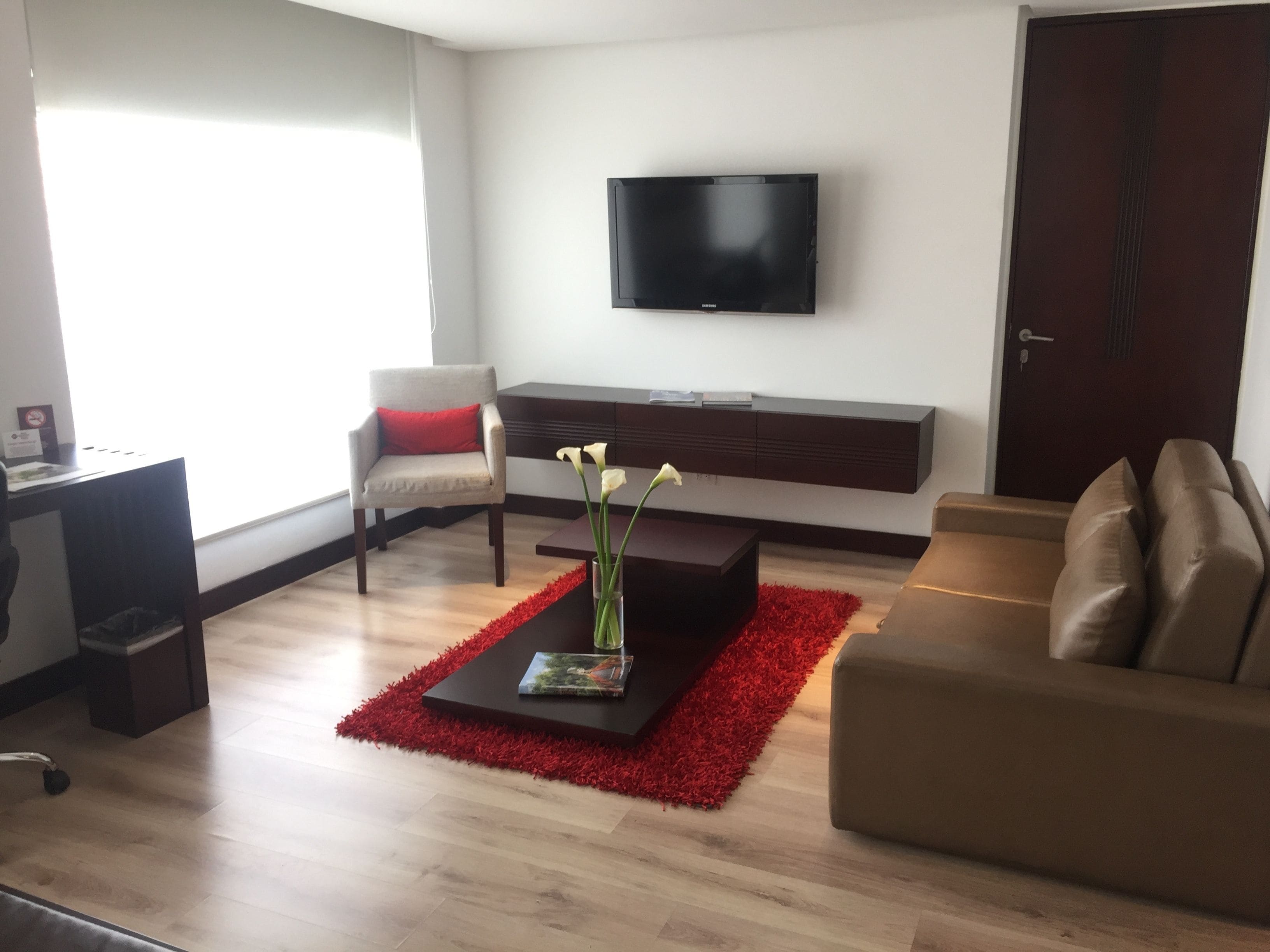 suite, 1 king bed, non smoking (living room) | living area | 42-inch lcd tv with digital channels, tv, pay films