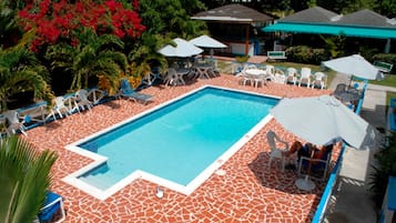 Outdoor pool, pool umbrellas, sun loungers