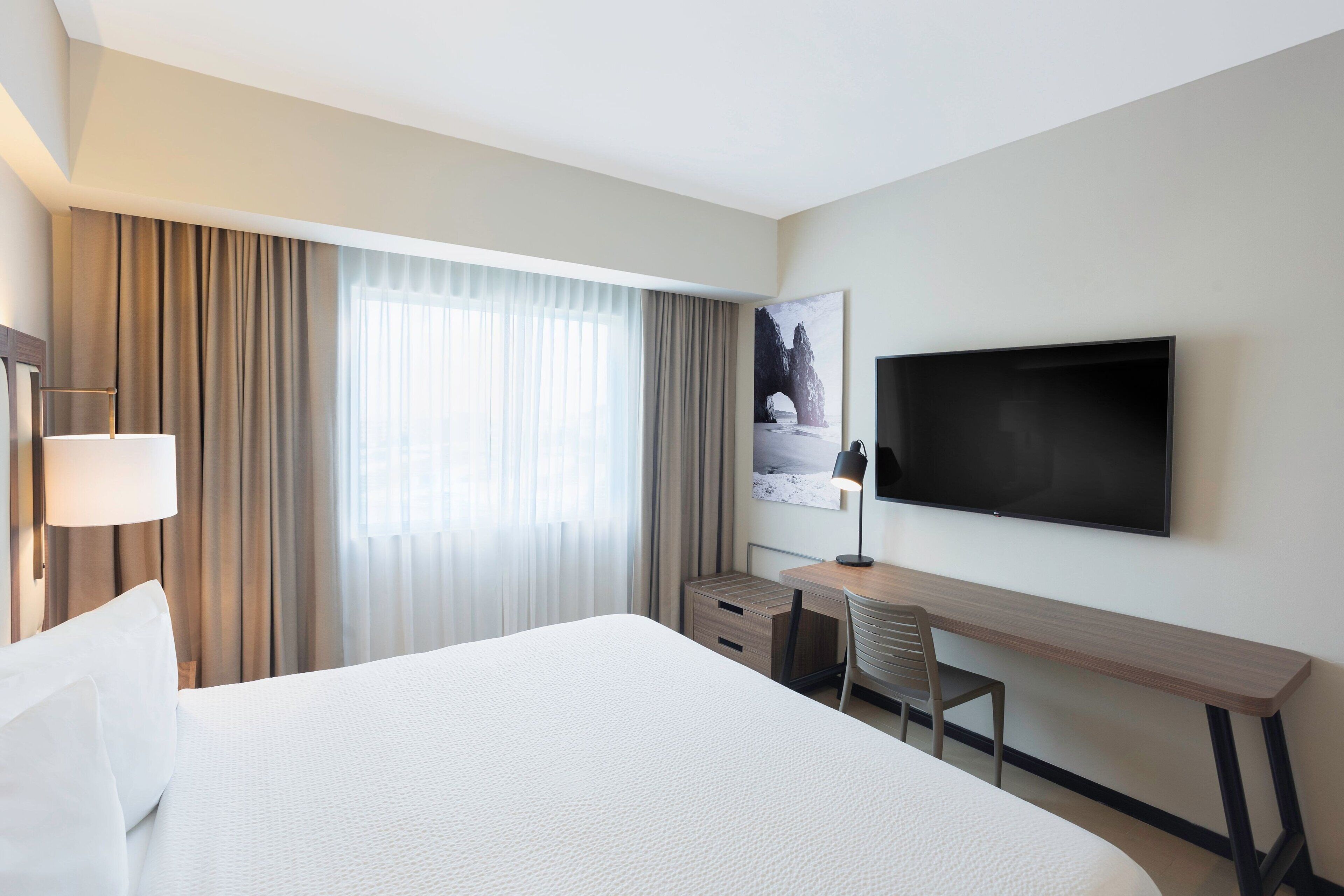 room, 1 king bed, non smoking | in-room safe, desk, laptop workspace, blackout curtains