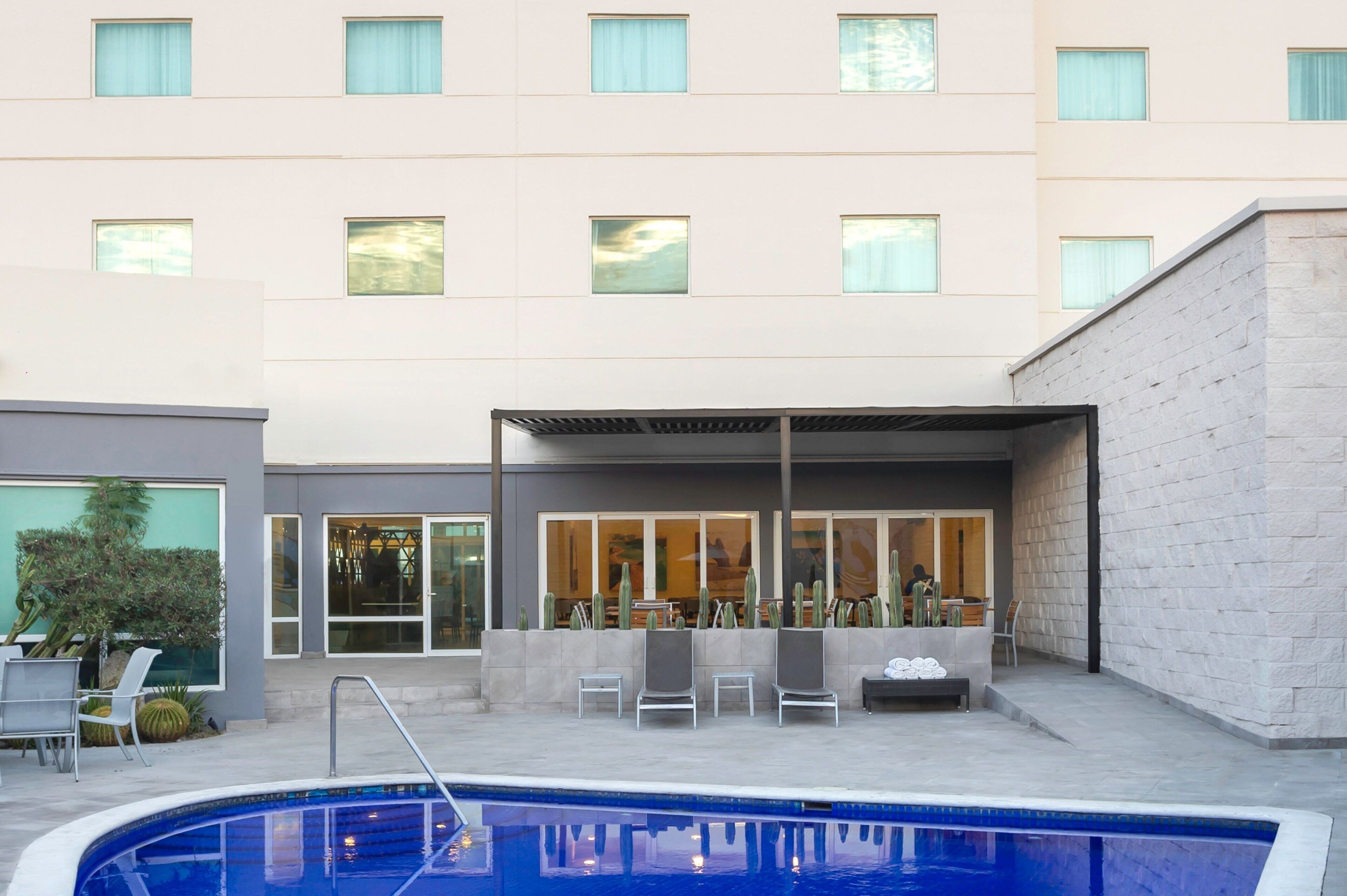 outdoor pool, pool umbrellas, pool loungers