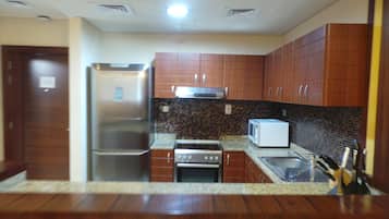 Fridge, microwave, cookware/dishes/utensils