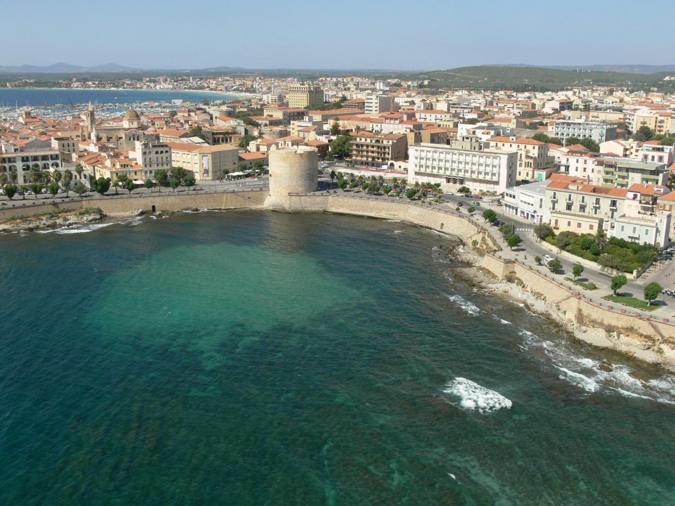 beach nearby, white sand, beach umbrellas, beach towels