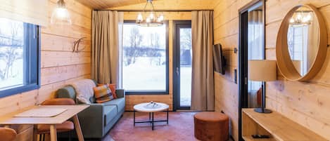 Departamento Deluxe | Área de sala de estar | Televisión de pantalla plana