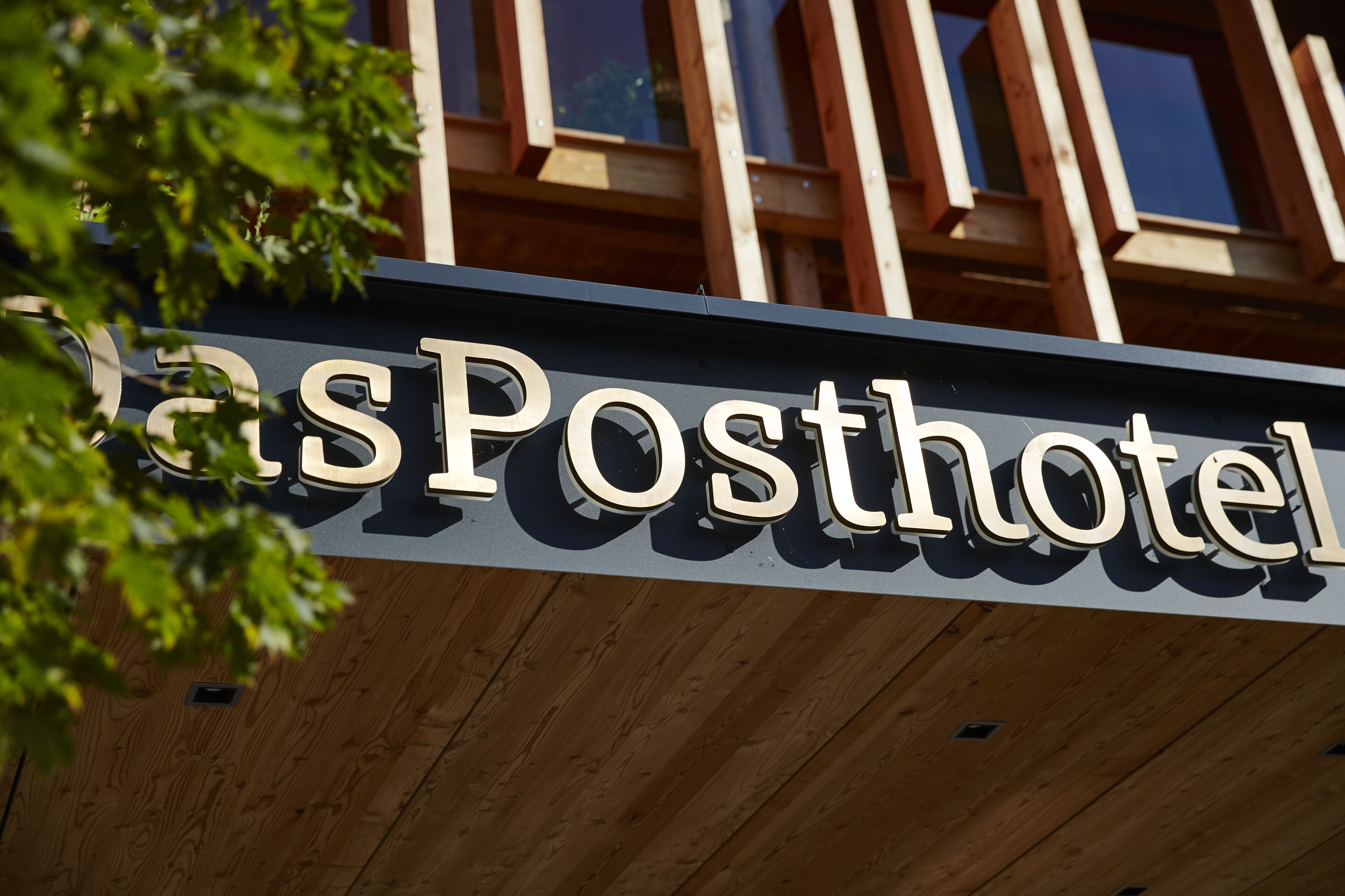 A hotel sign with the name "GasPosthotel" in large, clear letters.