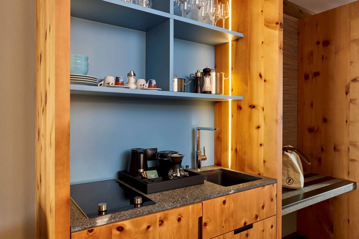 fridge, stovetop, electric kettle, high chair