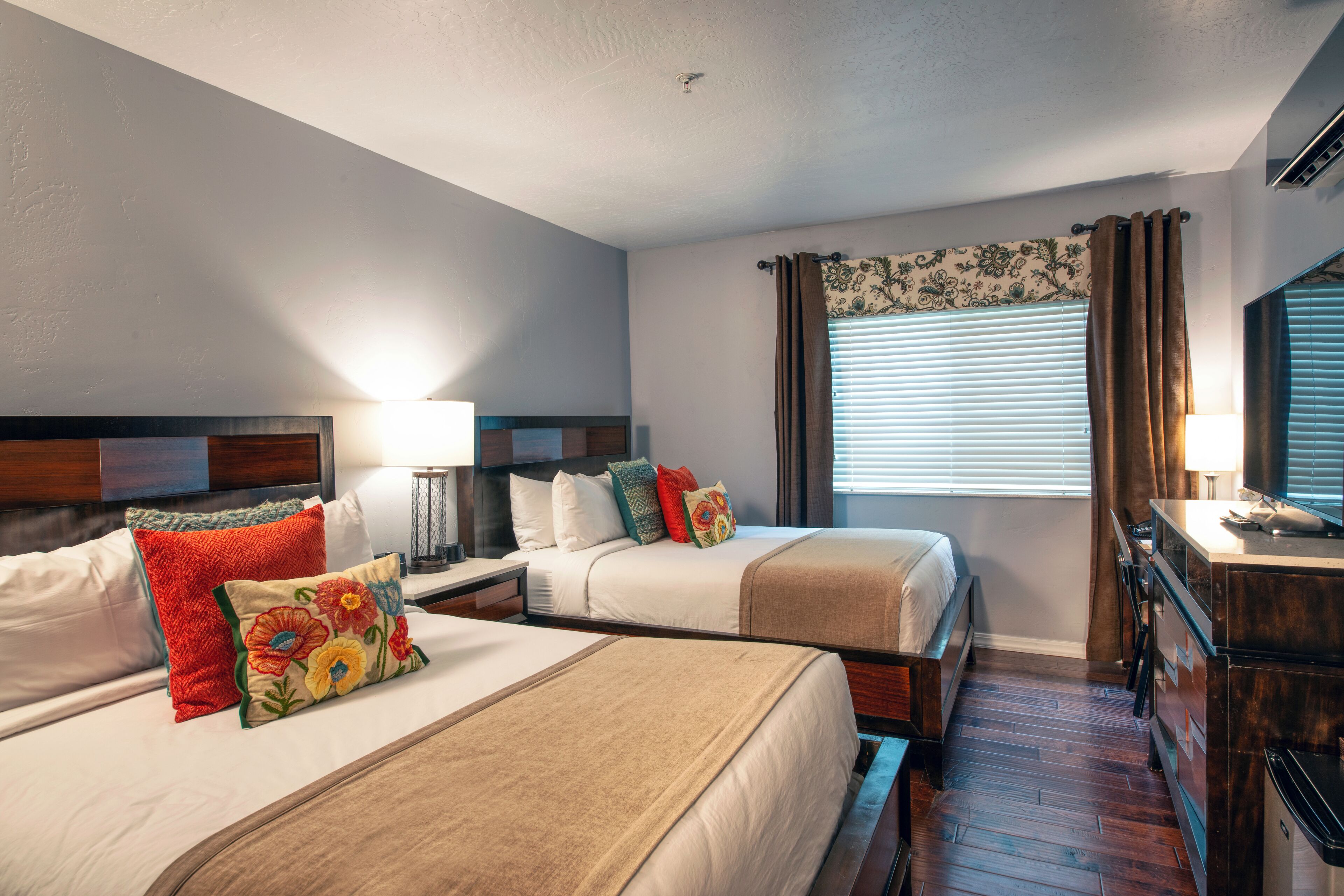 deluxe room, 2 queen beds | premium bedding, desk, iron/ironing board, wifi