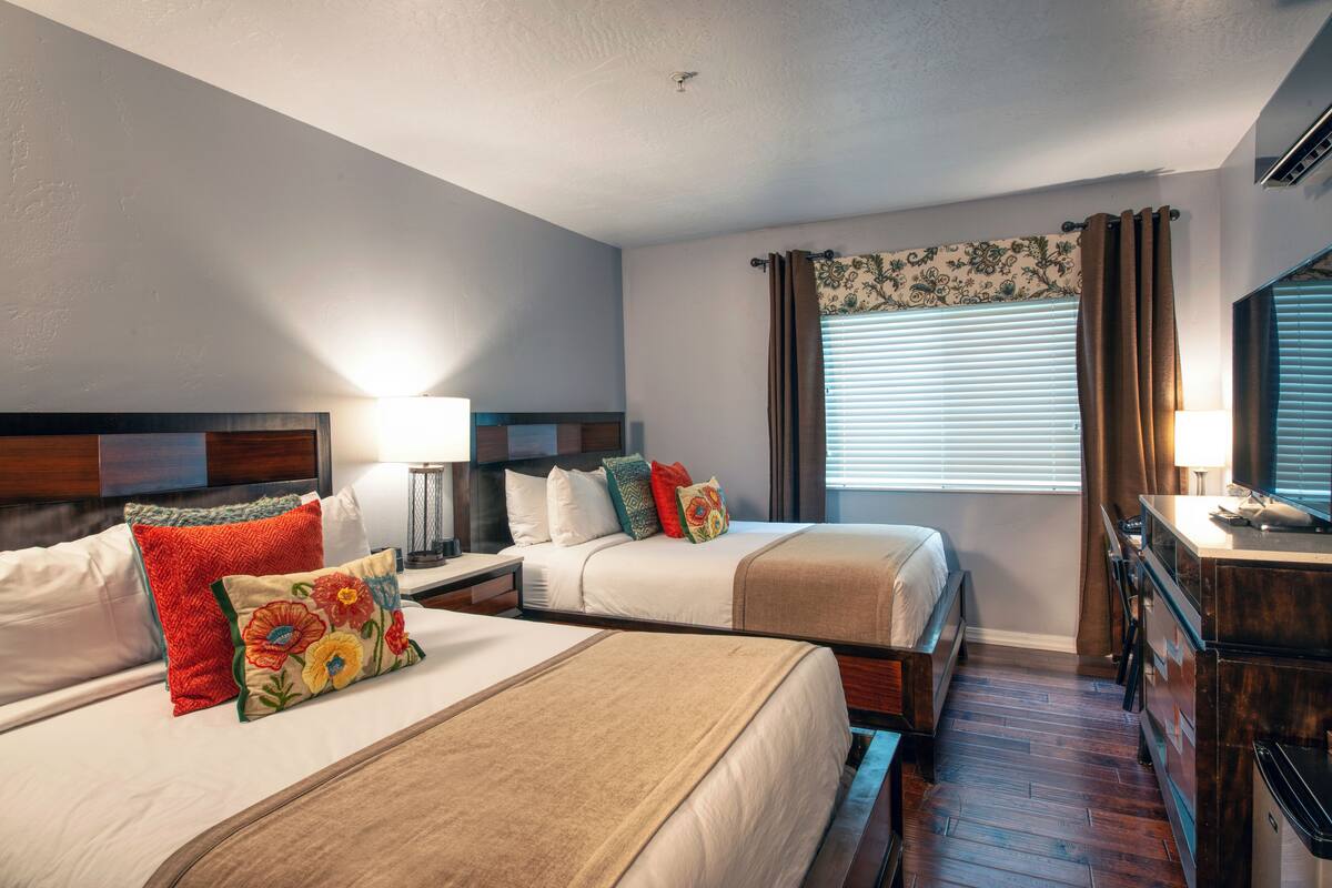 deluxe room, 2 queen beds | premium bedding, desk, iron/ironing board, wifi