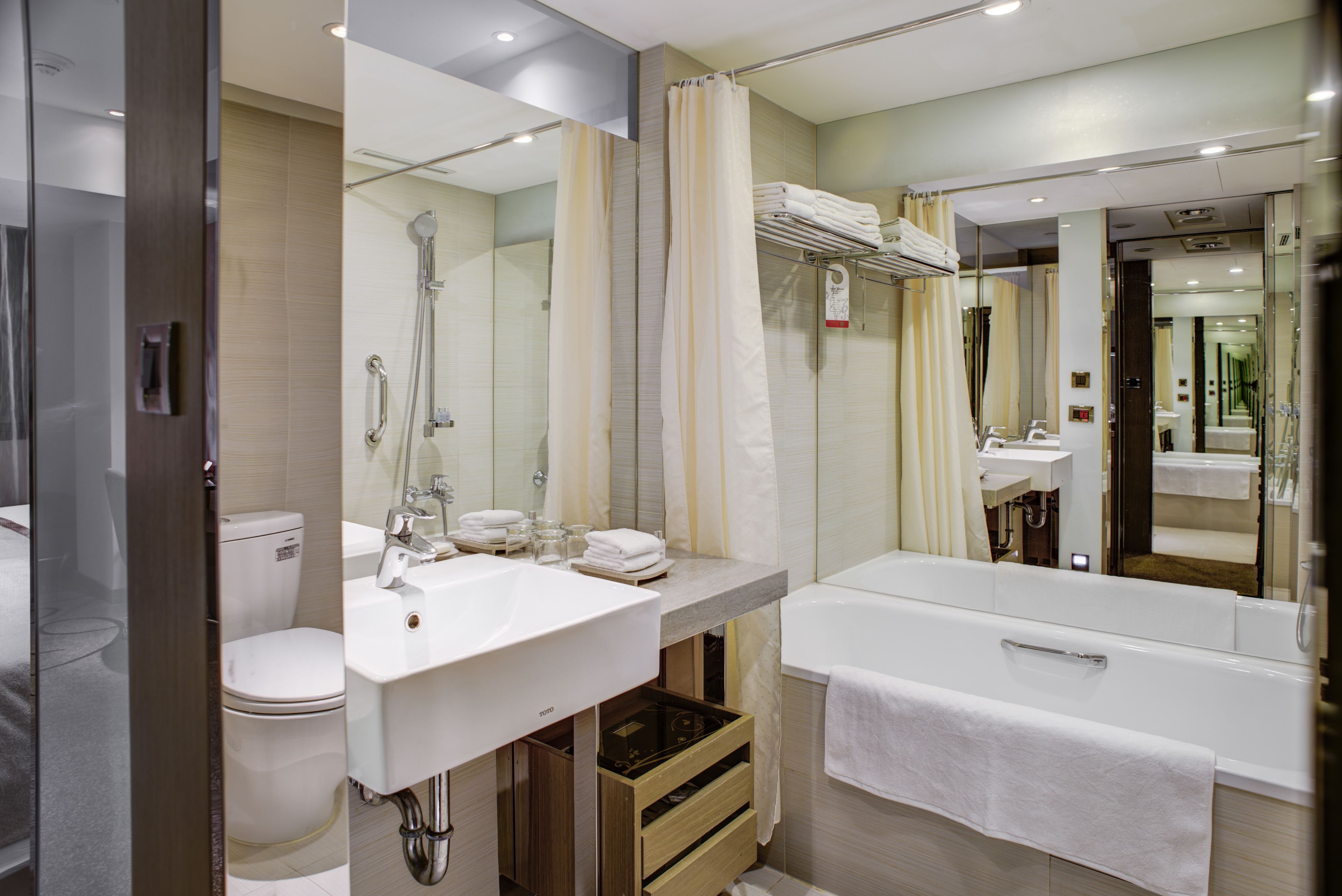 superior twin room | bathroom | shower, eco-friendly toiletries, hair dryer, bathrobes