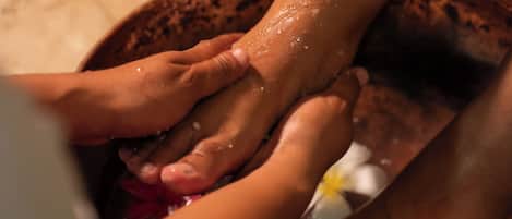 Hands being washed in a bowl.