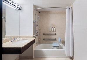 A modern bathroom with a bathtub, shower, and two sinks. - Fairfield Inn & Suites by Marriott Denver Aurora / Parker (Aurora)