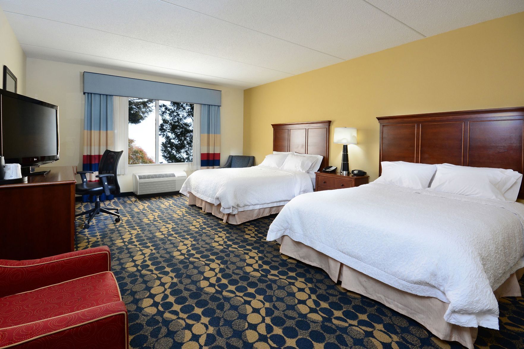 Premium bedding, desk, blackout drapes, iron/ironing board