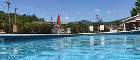 Seasonal outdoor pool, pool loungers