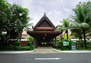 A traditional Thai pavilion with a tiled roof, surrounded by lush greenery and palm trees. - Sokhalay Angkor Villa Resort (Siem Reap)