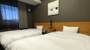 A hotel room with two beds, a nightstand, a lamp, and a painting on the wall. - Hotel Route-Inn Omaezaki (Omaezaki)