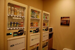Vending machines with various beverages and snacks.