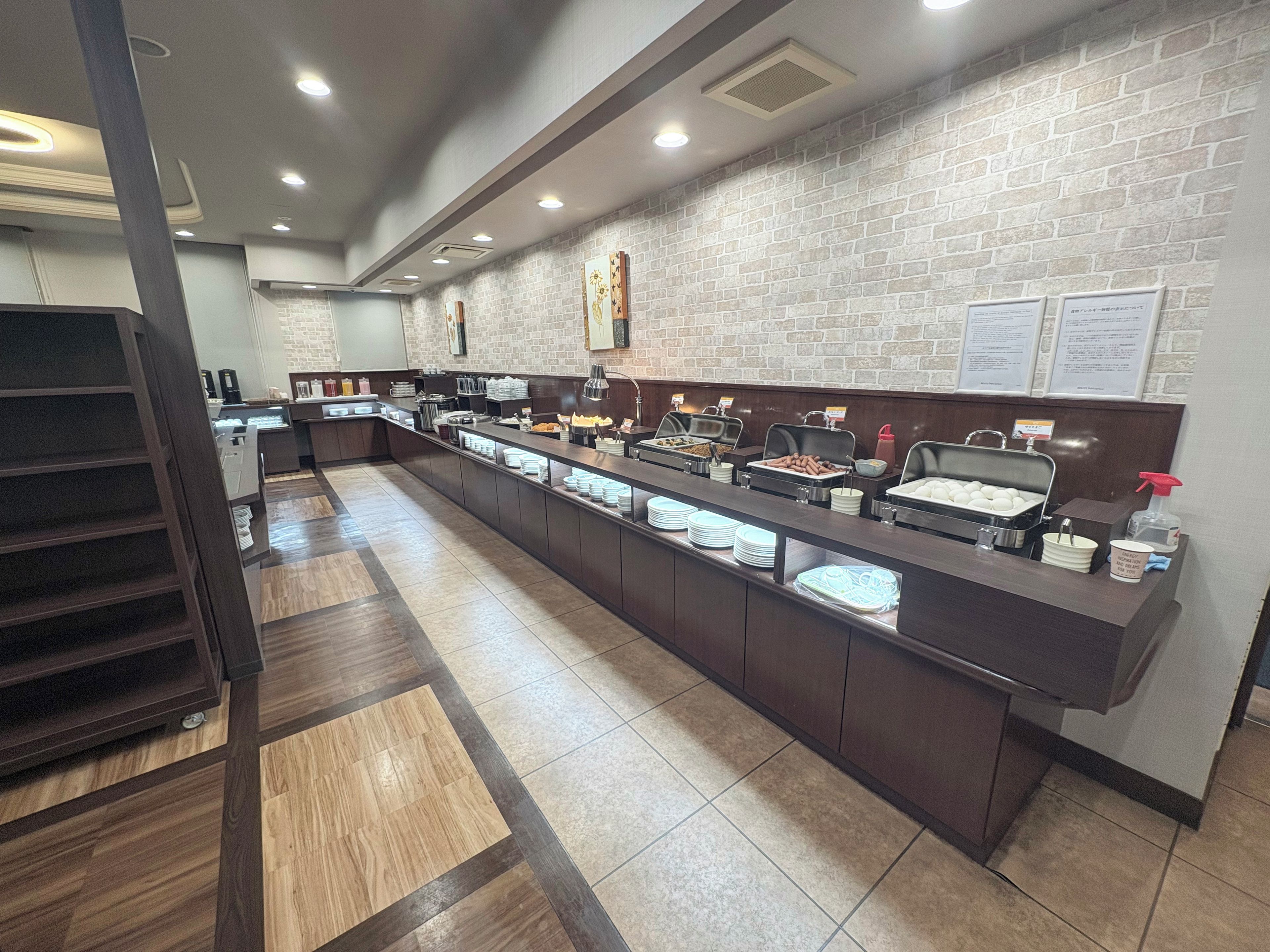 A buffet setup with various food items and a counter.