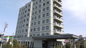 A multi-story hotel with a modern design, featuring a flat roof and a uniform facade. - Hotel Route-Inn Nakatsugawa Inter (Nakatsugawa)