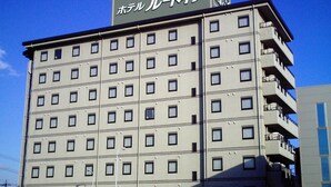 A multi-story hotel with a uniform facade, numerous windows, and balconies on the upper floors. - Hotel Route-Inn Oogaki Inter (Ogaki)